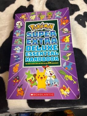 Pokémon Super Extra Deluxe Essential Handbook - Purple Cover